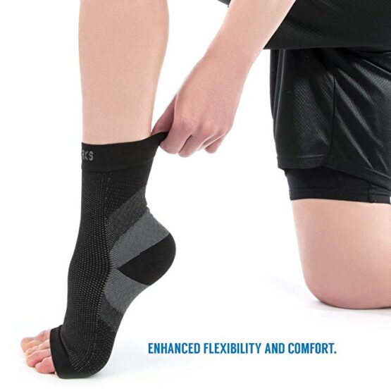 Person putting on Plantar Fasciitis Compression Socks