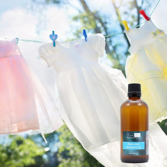 Fresh Linen on Clothes Line with Fresh Linen Fragrance bottle.